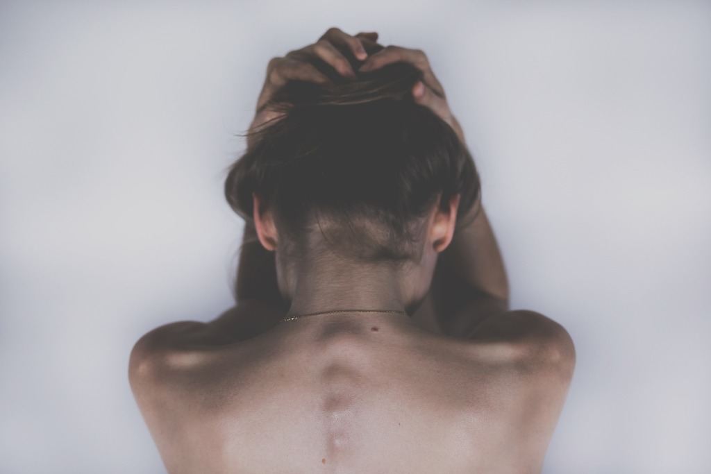 view of a woman's spine - featured image